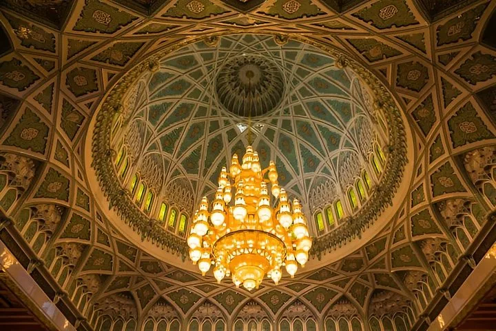 Another view of the stunning chandelier and intricate dome ceiling inside the mosque.