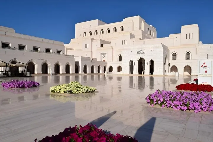 Courtyard of the Royal Opera House Muscat with beautiful flower beds.